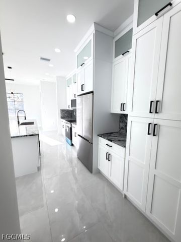 913 Glenn AVE, Lehigh Acres, FL 33972