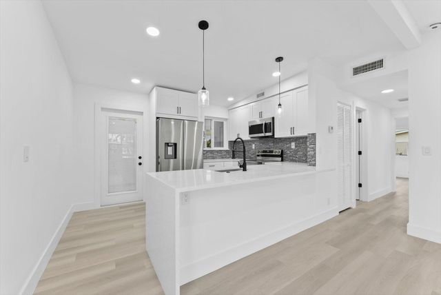 5737 Honeysuckle Drive, West Palm Beach, FL 33415