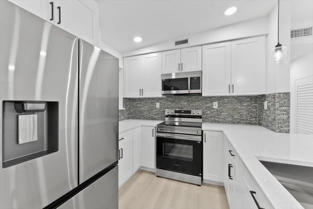 5737 Honeysuckle Drive, West Palm Beach, FL 33415