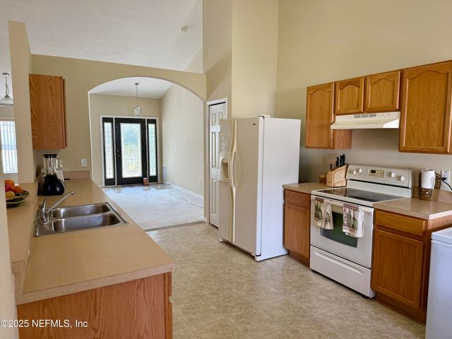 24 SEVILLE ORANGE Path, Palm Coast, FL 32164