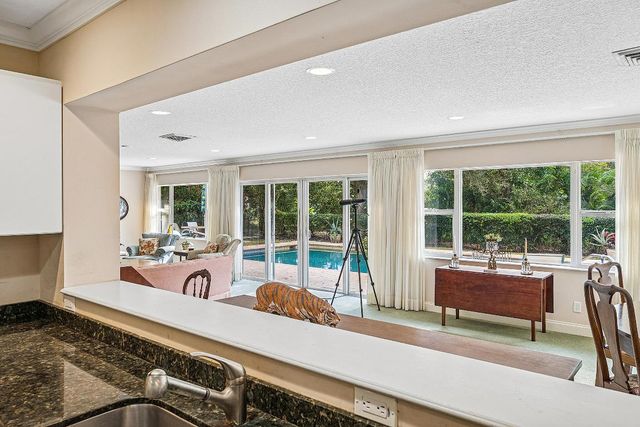 416 S Country Club Drive, Atlantis, FL 33462