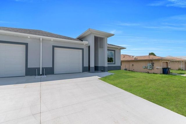 734 JACK AVENUE S, Lehigh Acres, FL 33973