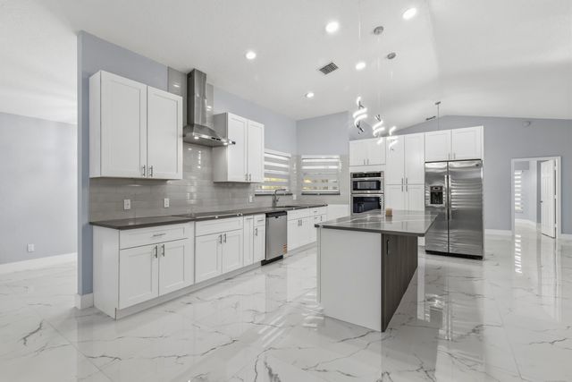 104 Oxford Court, Royal Palm Beach, FL 33411