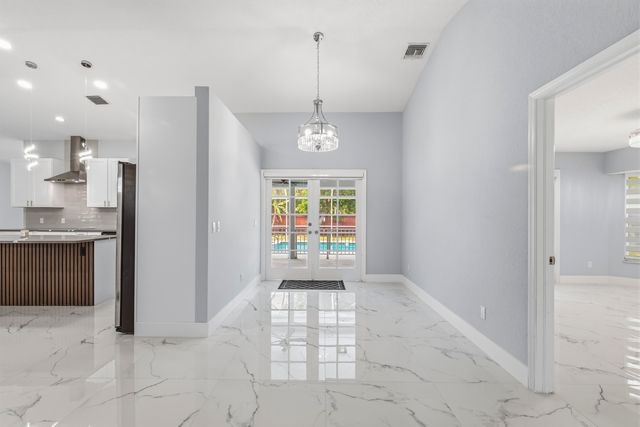 104 Oxford Court, Royal Palm Beach, FL 33411