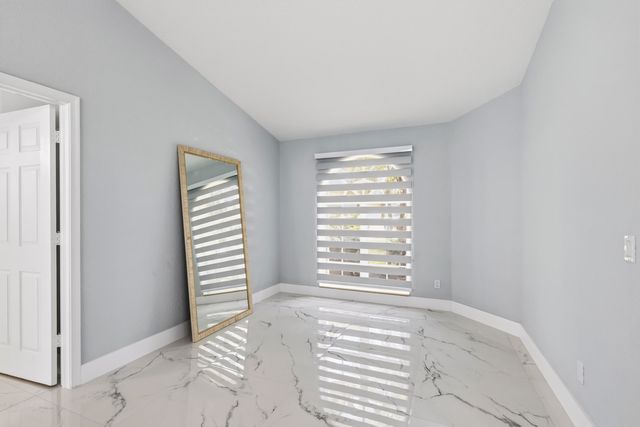 104 Oxford Court, Royal Palm Beach, FL 33411
