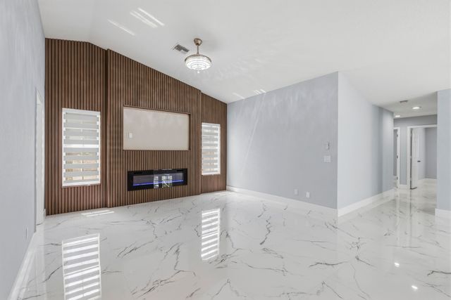104 Oxford Court, Royal Palm Beach, FL 33411