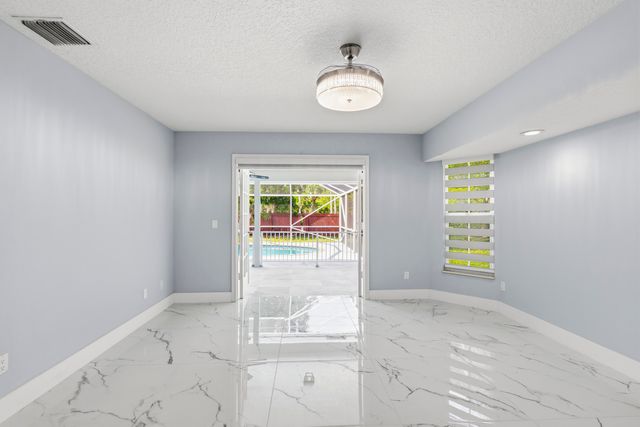 104 Oxford Court, Royal Palm Beach, FL 33411