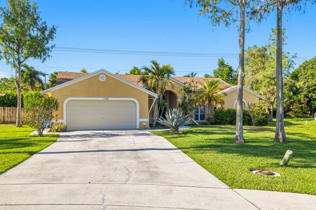 104 Oxford Court, Royal Palm Beach, FL 33411
