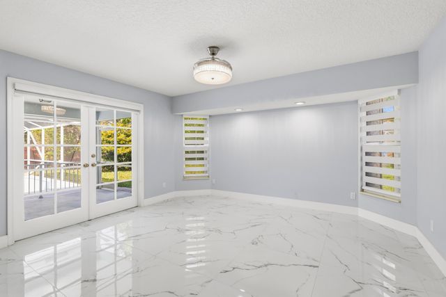 104 Oxford Court, Royal Palm Beach, FL 33411