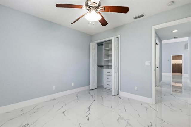 104 Oxford Court, Royal Palm Beach, FL 33411