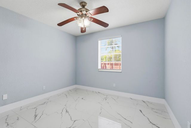 104 Oxford Court, Royal Palm Beach, FL 33411