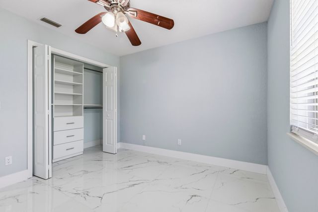 104 Oxford Court, Royal Palm Beach, FL 33411