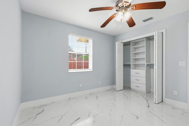 104 Oxford Court, Royal Palm Beach, FL 33411