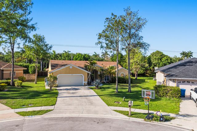 104 Oxford Court, Royal Palm Beach, FL 33411