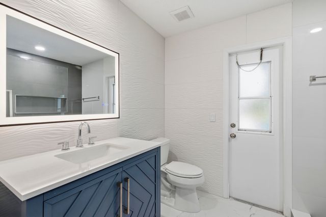 104 Oxford Court, Royal Palm Beach, FL 33411