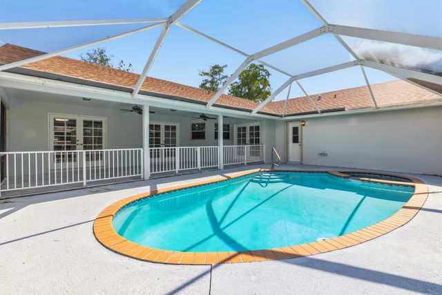 104 Oxford Court, Royal Palm Beach, FL 33411