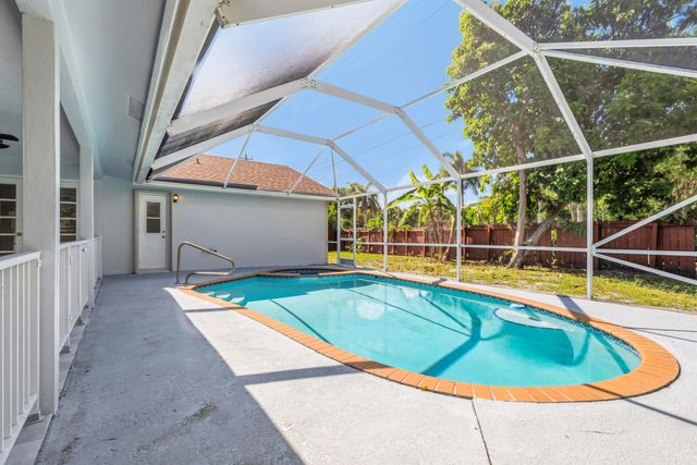 104 Oxford Court, Royal Palm Beach, FL 33411