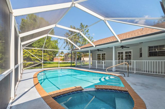 104 Oxford Court, Royal Palm Beach, FL 33411