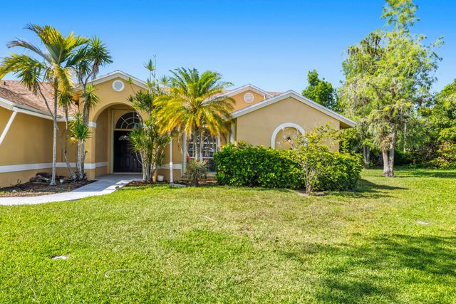 104 Oxford Court, Royal Palm Beach, FL 33411