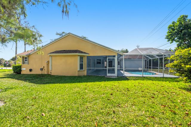 104 Oxford Court, Royal Palm Beach, FL 33411