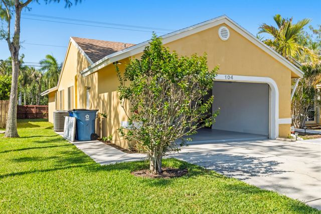 104 Oxford Court, Royal Palm Beach, FL 33411