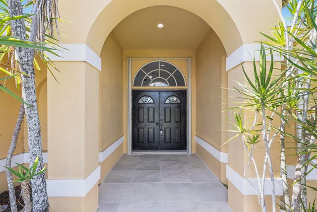 104 Oxford Court, Royal Palm Beach, FL 33411