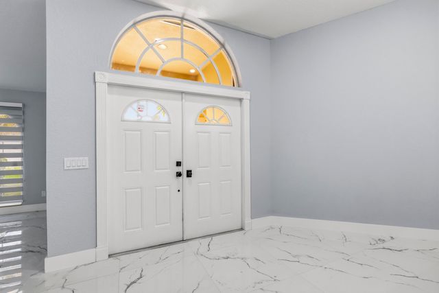 104 Oxford Court, Royal Palm Beach, FL 33411