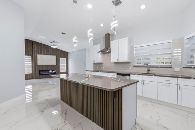 104 Oxford Court, Royal Palm Beach, FL 33411