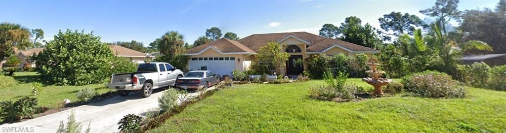 610 THOMPSON AVE, LEHIGH ACRES, FL 33972 — exterior