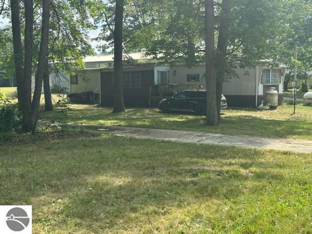 Image 1 of property listing at 7885 N Airpark Road, Weidman, MI 48893