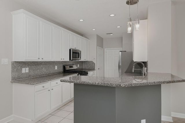 11 Scenic Brook Court, The Woodlands, TX 77382