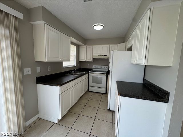 1112 Gifford AVE S, Lehigh Acres, FL 33936