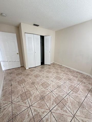 1034 W Jasmine Ln, North Lauderdale, FL 33068