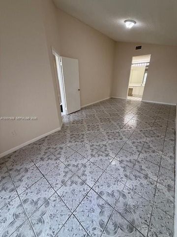 1034 W Jasmine Ln, North Lauderdale, FL 33068