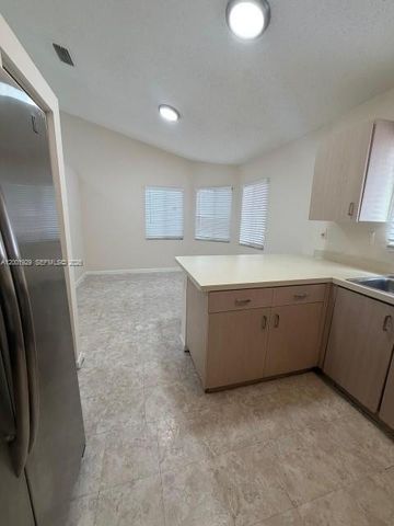 1034 W Jasmine Ln, North Lauderdale, FL 33068