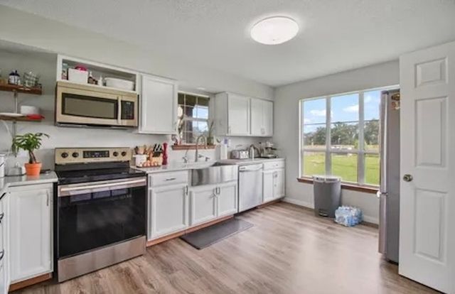 11074 W 64 (3 Homes+50ac) Highway, Overton, TX 75684