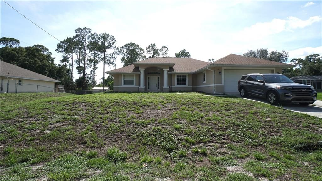 413 Truman AVE, LEHIGH ACRES, FL 33972 — exterior