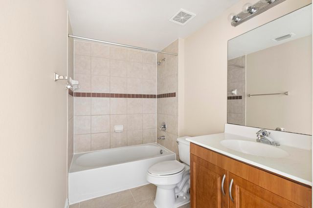 6434 EMERALD DUNES Drive 104, West Palm Beach, FL 33411