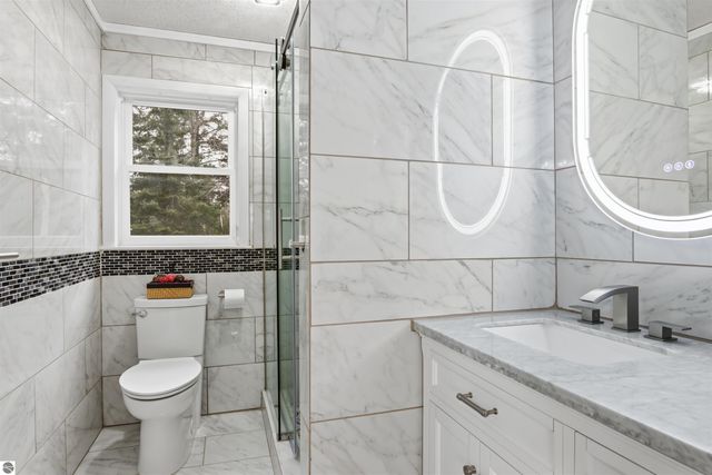 14455 Birch Point Drive, Kewadin, MI 49648