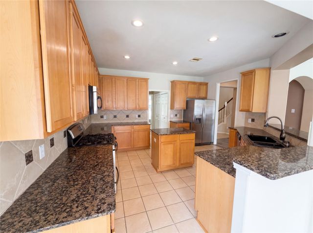 7711 Chadbourne Trace Court, Richmond, TX 77407
