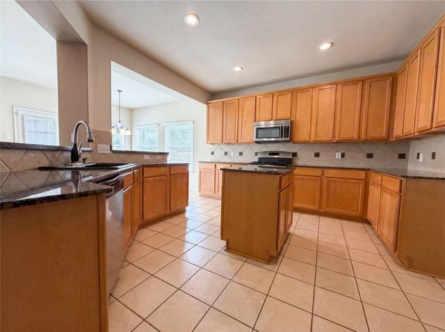 7711 Chadbourne Trace Court, Richmond, TX 77407