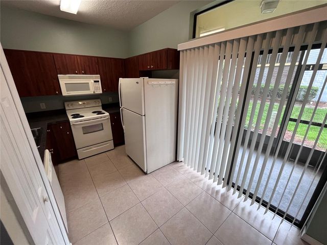 6007 SCOTCHWOOD GLEN 31, Orlando, FL 32822