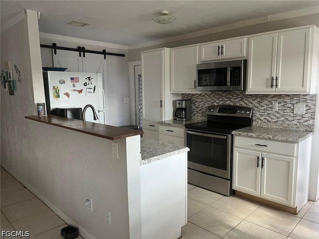 1102 Kanza CT, Lehigh Acres, FL 33936