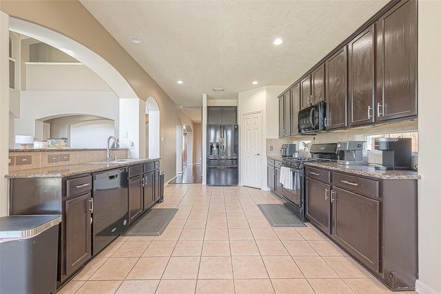 9018 Carriage Point Drive, Sugar Land, TX 77479