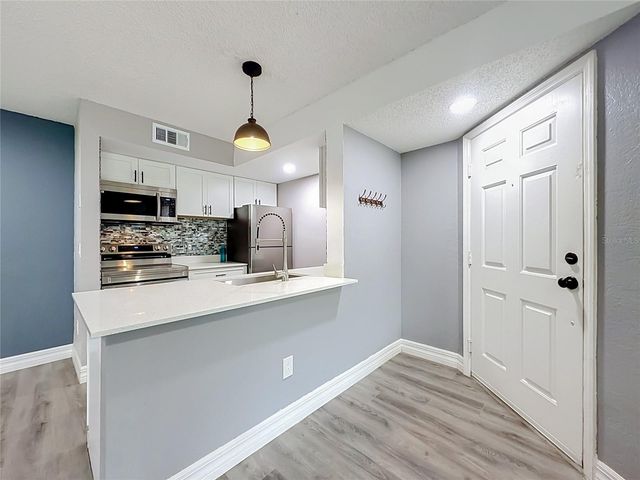 5144 CONROY ROAD 13, Orlando, FL 32811