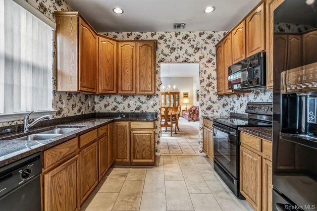 587 Leisure Drive, Ridge, NY 11961