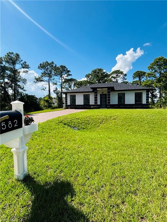 582 Eisenhower BLVD, LEHIGH ACRES, FL 33974 — exterior