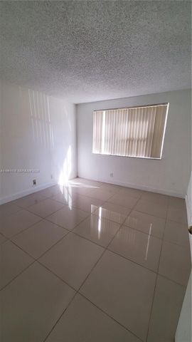 9055 Wiles Rd 103, Coral Springs, FL 33067