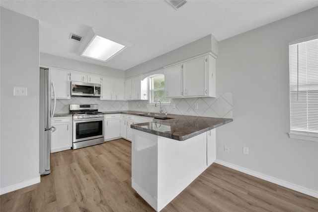 9898 Twin Shores Drive, Willis, TX 77318