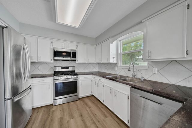 9898 Twin Shores Drive, Willis, TX 77318